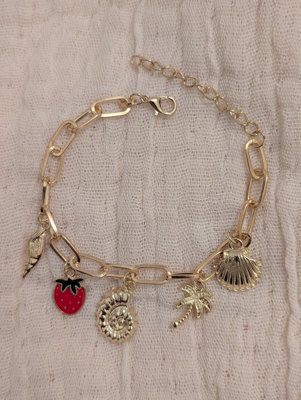 Gold Charm Bracelet with Red Strawberry and Shell Accents